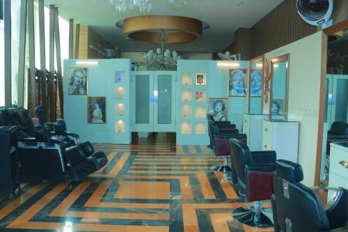 a hair salon with chairs and a waiting room at Safari Club 1 in Rawalpindi