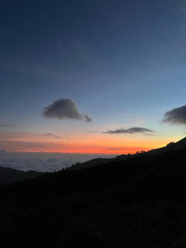 a sunset from the top of a mountain at Aulia Bungalows in Tetebatu