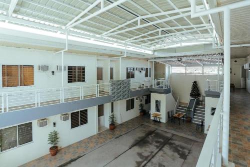 an empty room with white walls and a ceiling at LJENJ Apartelle near Clark Airport in Mabalacat