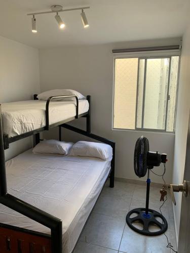 Ένα ή περισσότερα κρεβάτια σε δωμάτιο στο Apartamento acogedor