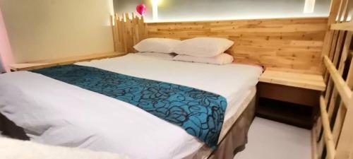a bedroom with two beds with white sheets at YUYU B2 Honeymoon WiFi Genting highland in Genting Highlands