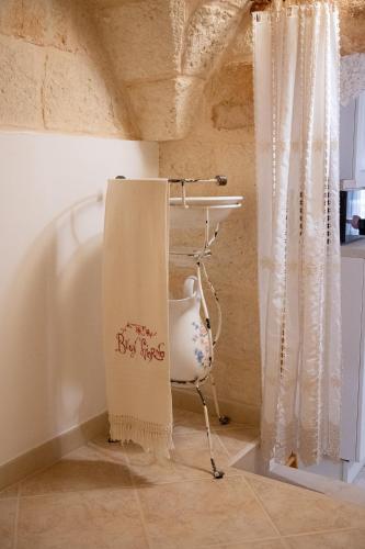 a towel hanging on a chair in a room at La Stella Del Pupo CATALDO in Fasano