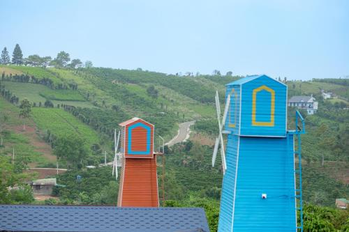 two roller coasters on a hill with a road at Healing Space Bungallow Bao Loc in Bao Loc