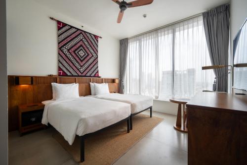 Postel nebo postele na pokoji v ubytování Granbell Hotel Colombo