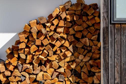 a pile of wood sitting on top of a table at Ligar Escape - Golden Bay Holiday Home in Tarakohe