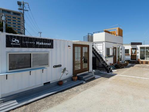a house that is being built in a parking lot at コンテナホテルハコネル in Shirahama