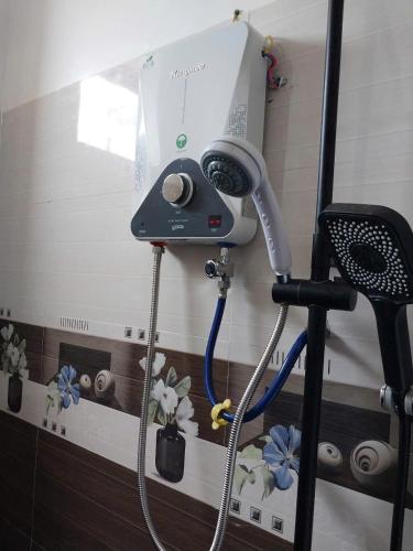 a hair dryer on a wall in a room at Biệt Thự Villa Thảo Vy in Ly Son