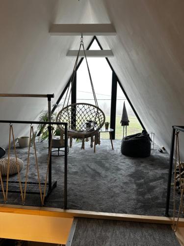 a room with a hammock in a tent at Zsóry Cabinbox in Mezőkövesd