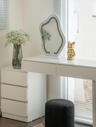 a white dressing table with a mirror and a stool at De Lavie Villa DaLat in Khu Chi Lăng