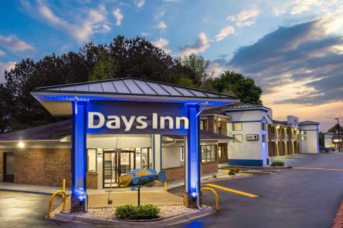 a day inn sign in front of a building at Days Inn by Wyndham Weldon Roanoke Rapids in Weldon