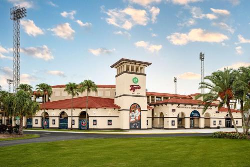 a building with a clock tower in a park at Hyatt Place Lakeland Center in Lakeland