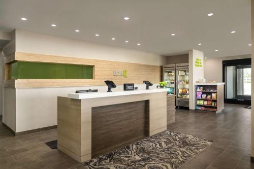 a lobby of a hospital with a reception counter at Home2 Suites By Hilton Conyers Atlanta in Conyers