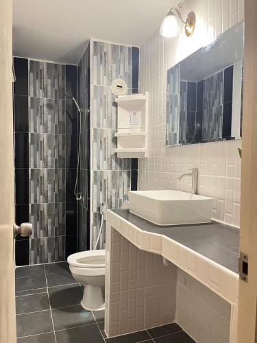 a bathroom with a sink and a toilet at T12 Popular Condo By : hunnity in Ban Bang Phang