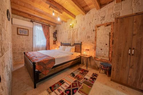 Ένα ή περισσότερα κρεβάτια σε δωμάτιο στο Cappalace Stone House