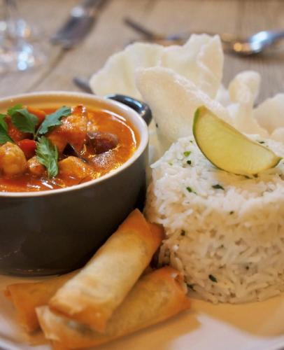 a plate of food with a bowl of soup and rice at White Hart Hotel in Dorchester on Thames