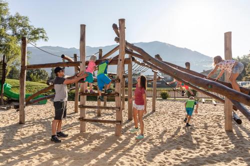a group of people playing on a playground at Apparthaus Anderl in Zellbergeben