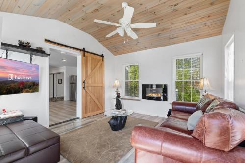 a living room with a couch and a ceiling fan at Little Bit Of Country in Sevierville