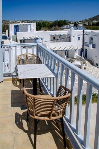 a table and two chairs sitting on a balcony at Hotel Livadia in Parikia