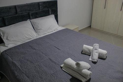 Ένα ή περισσότερα κρεβάτια σε δωμάτιο στο Samaras seaside apartment
