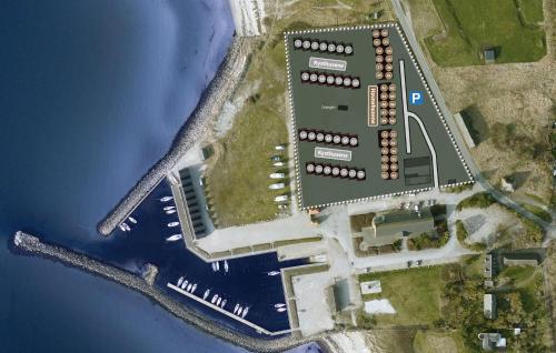 an aerial view of a building next to the water at Havnehusene, Lejl 61 in Engvang