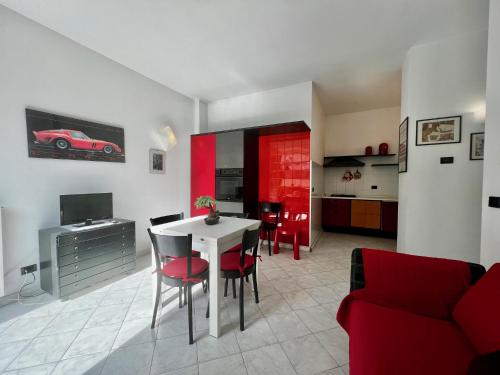 a kitchen and living room with a table and chairs at Villa Rocca - appartamento 3 in Borgio Verezzi