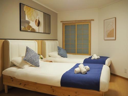 Postel nebo postele na pokoji v ubytování 17 JR上野駅3分钟 13人房 5LDK 110平别墅丨Ueno Villa 3 minutes from Ueno Station 13 people