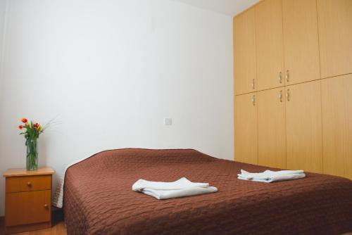 Letto o letti in una camera di Valentinos Apartments