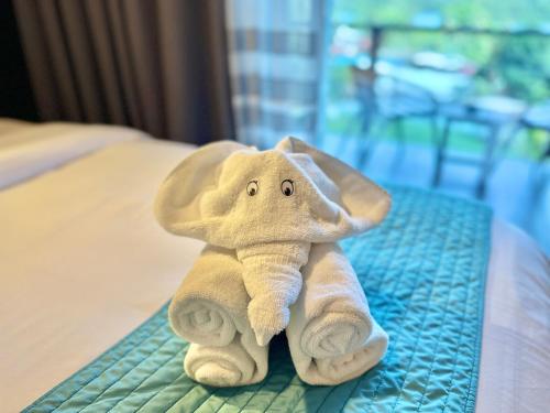 Postel nebo postele na pokoji v ubytování Palau Central Hotel