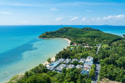 an aerial view of a beach with condos at Phuket Moonlit Bay Seaview Resort & Spa in Phuket