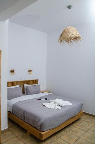 a bedroom with a large bed with aoit at Hotel Livadia in Parikia