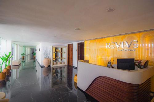 a lobby with a reception desk in a building at Ululani Bali in Uluwatu