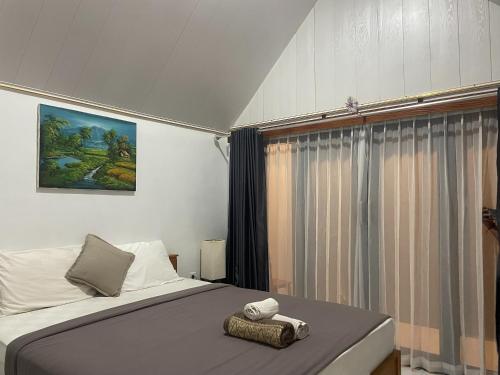 Letto o letti in una camera di The Iris Kintamani
