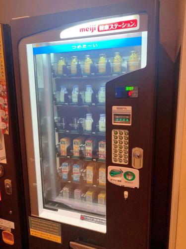 a vending machine with food inside of it at Dormy Inn Premium Namba Natural Hot Spring in Osaka