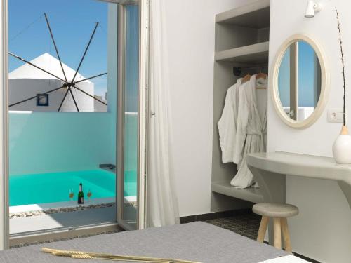 a bathroom with a view of the ocean at Drops Villas in Vóthon