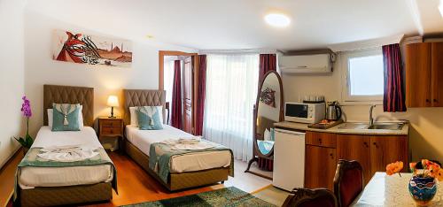 Postel nebo postele na pokoji v ubytování Sultan House