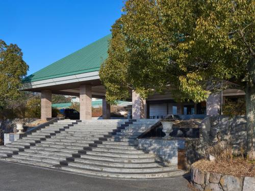 a set of stairs in front of a building at Mission Hills Hotel in Minano