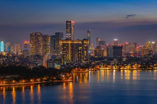 a view of a city skyline at night at Pan Pacific Hanoi in Hanoi
