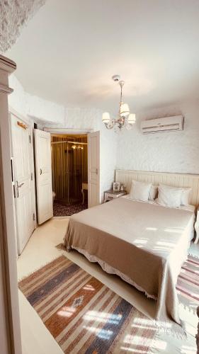 Ένα ή περισσότερα κρεβάτια σε δωμάτιο στο Mina Otel by Adda Alaçatı