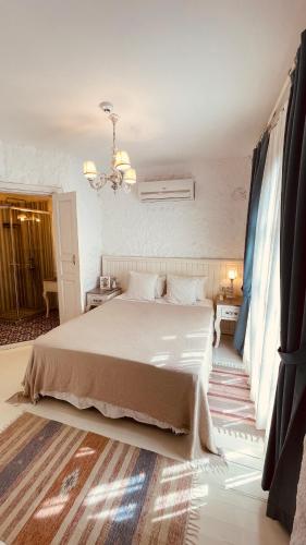Ένα ή περισσότερα κρεβάτια σε δωμάτιο στο Mina Otel by Adda Alaçatı
