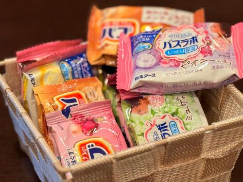 a basket filled with different types of snacks at The Noborisaka Village -登り坂ビレッジ- in Fujikawaguchiko