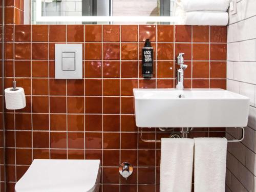 a bathroom with a sink and a toilet at greet Tbilisi Center in Tbilisi City