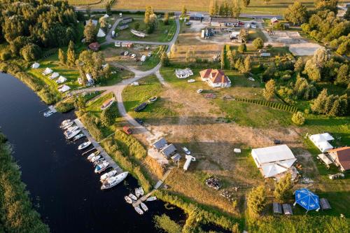 an aerial view of a marina with a bunch of boats at Cozy little house with sauna on a fishing boat in Pärnu