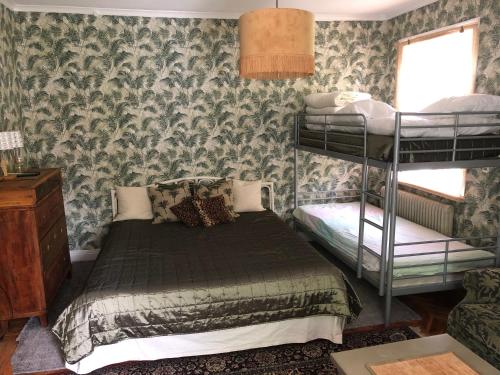 a bedroom with two bunk beds and a window at Villa Betty in Visby