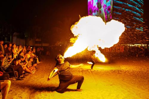 a man is standing in front of a fire show at Lexis Hibiscus Port Dickson in Port Dickson