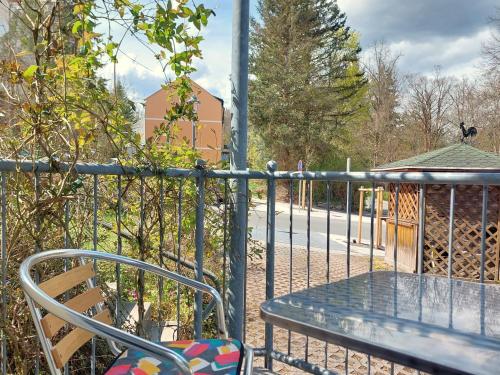 a chair sitting on a fence next to a playground at Villa Hoffnung in Bad Elster