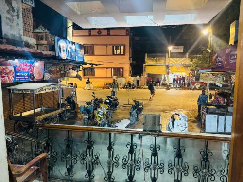 a view from a window of a street at night at Singh Hotel's Shubhadra Boutique Stay in Mathura