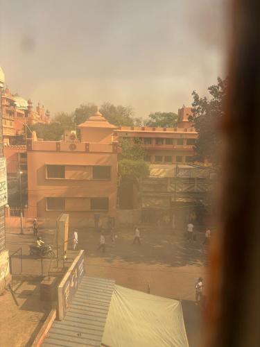 a group of people standing in front of a building at Singh Hotel's Shubhadra Boutique Stay in Mathura