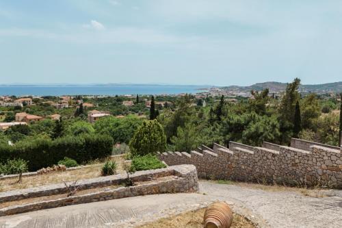 a set of stone stairs with a stone wall at Kampos View Villa in Chios