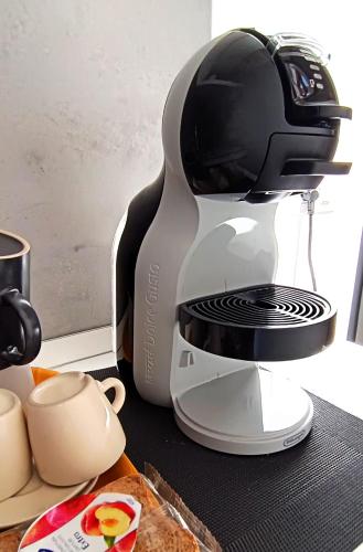 a coffee maker sitting on top of a counter at La casa di mest Pepp in Monopoli