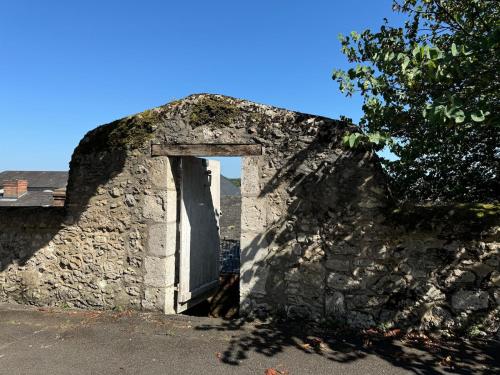 an old stone building with a door in it at Luxury apartment for 4 people in Blois